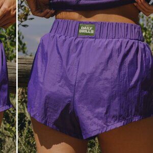DAILY DRILLS SUPER BOUNCE SIDE STRIPE SHORTS IN PURPLE XL $64